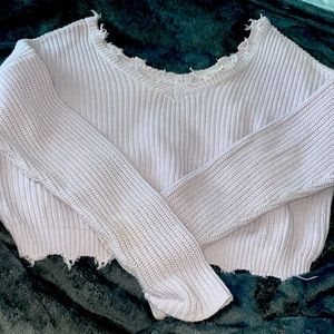 this is a crop top hoodie it’s a light purple and the size is Medium